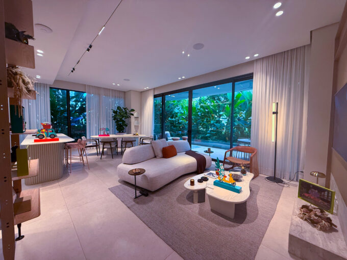 Image of living area with balcony, couch, and table in this condo for sale in Bioma