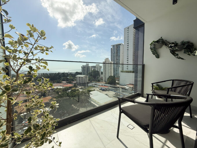 Image of balcony with city views and two chairs in this condo for sale in NEXT in Coco del Mar