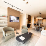 Image of living area with two chairs, couch and table in this condo for sale in Next in Coco del Mar