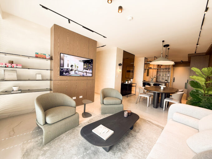 Image of living area with two chairs, couch and table in this condo for sale in Next in Coco del Mar