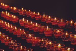 General image of lit candles in a church
