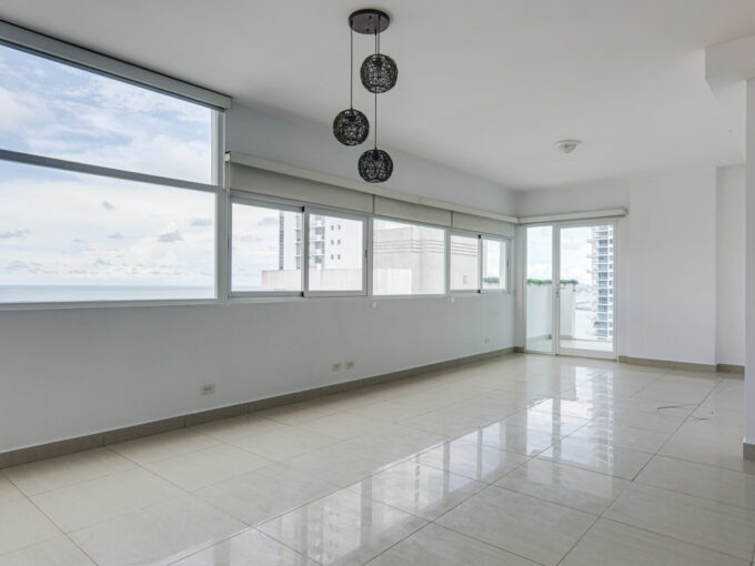 Image of living area with windows showcasing ocean views at Green View