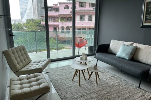 Image of living area with two chairs and couch in this condo for sale in Allure