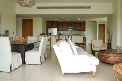 Image of the living area with a couch, table, and chairs at Altamar