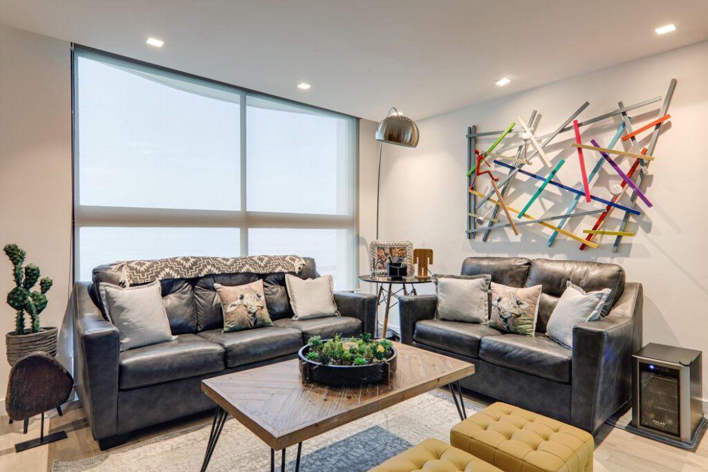 Image of living area with two couches, a table and chair at Baleares