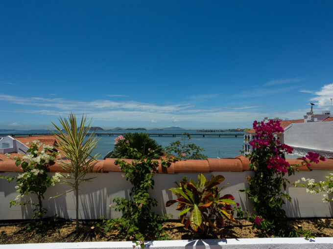 Image of terrace with ocean view in this condo for sale in Cuatro Casas