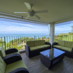 Image of the patio with a table and 4 couches in Galeones Ensenada