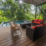 Image of the terrace with couch and swimming pool in Burn Brae plantation in Bocas del Toro