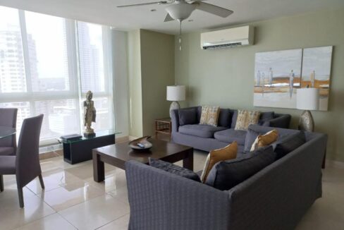 Image of living room with sofas, tables,lamp,AC and ceiling fan in Villa del Mar Avenida Balboa