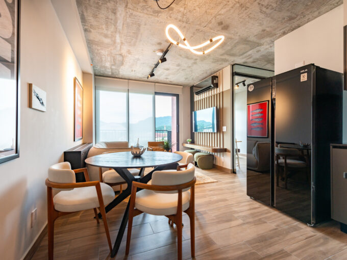 Image of refrigerator, couches and windows in this condo in Centriqo