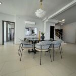 Image of living area with table and chairs in this condo in Country Club