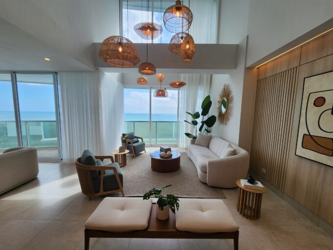 Image of living space with couch, two chairs, and balcony in this loft in Ocean Waves, Gorgona