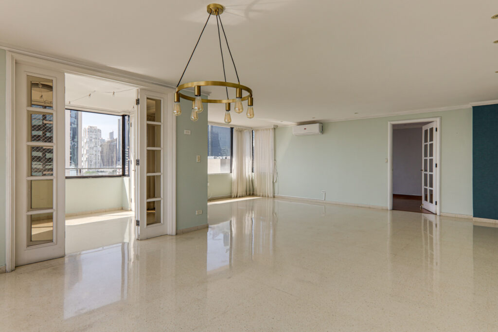Image of main living area with windows, curtains and lamp in this condo in La Ronda