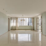 Image of main living area with windows, curtains and lamp in this condo in La Ronda