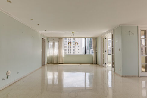 Image of main living area with windows, curtains and lamp in this condo in La Ronda