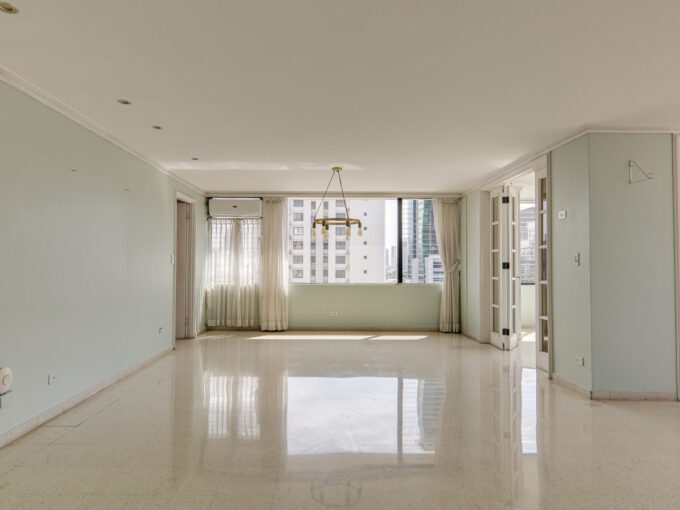 Image of main living area with windows, curtains and lamp in this condo in La Ronda