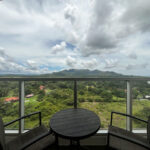 Image of balcony with a small table and two chairs in this condo in Royal Palm