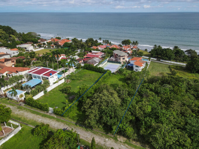 Image of this Costa Esmeralda lot for sale with views of the ocean and surrounding homes