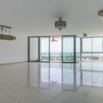 Image of the living room with balcony and large windows in this condo in Allure at the Park