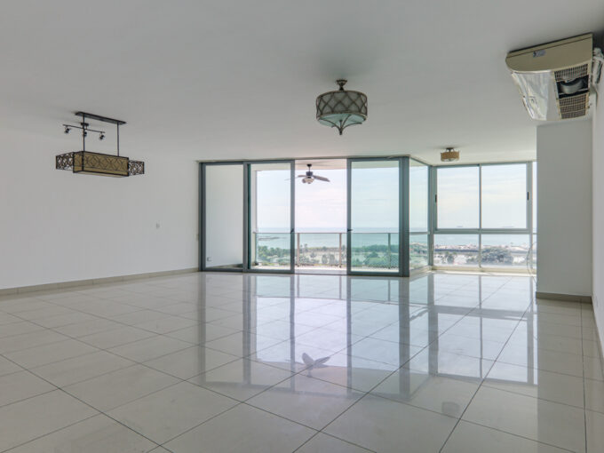 Image of the living room with balcony and large windows in this condo in Allure at the Park