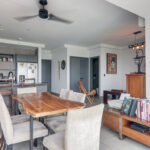 Image of the floor plan in this condo in Victory Sport in Coco del Mar with dining table, chairs, and view of the kitchen