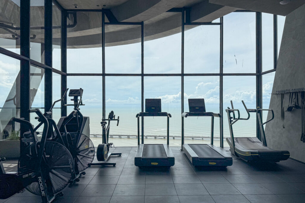 Image of gym looking out onto the ocean in this condo in Victory Sport in Coco del Mar