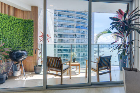 Image of balcony with two chairs in this condo in Oasis on the Bay