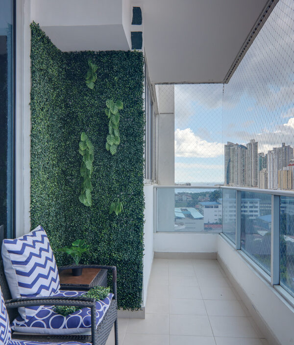 Image of balcony with two chairs and city views in this Remodeled Condo for Sale