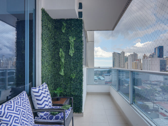 Image of balcony with two chairs and city views in this Remodeled Condo for Sale