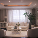 Image of living area with table, couch, and two chairs in this condo for sale in Belvedere Park