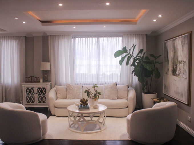 Image of living area with table, couch, and two chairs in this condo for sale in Belvedere Park