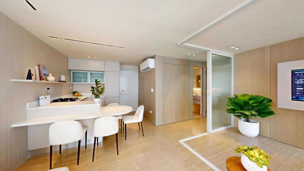 Image of living area with table and chairs in this condo for sale in Armonia