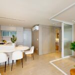 Image of main living area with views of kitchen in this Armonia condo for sale