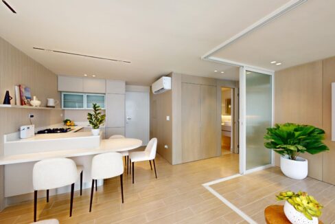 Image of main living area with views of kitchen in this Armonia condo for sale