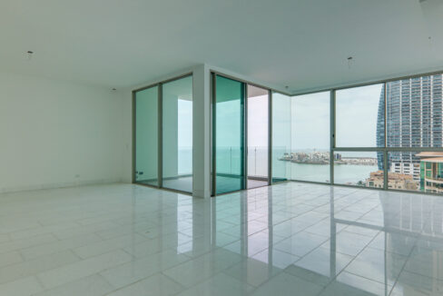 Image of the living area with ocean views in this condo for sale in Pacific Point 400