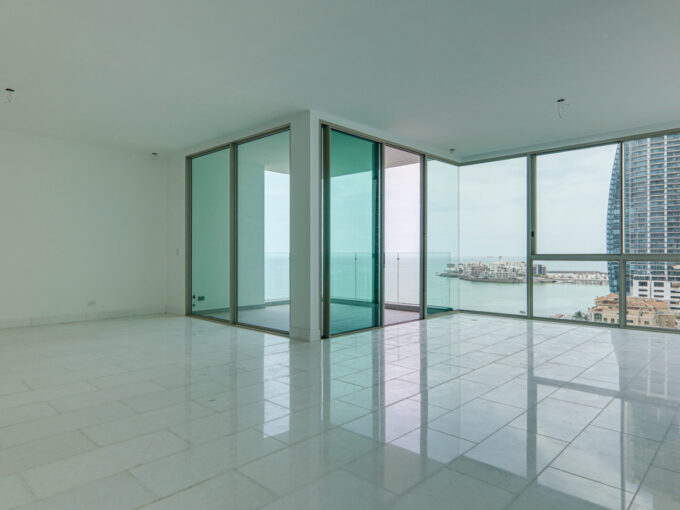 Image of the living area with ocean views in this condo for sale in Pacific Point 400