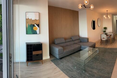 Image of living area with couch and table in this condo for rent in Allure at the Park
