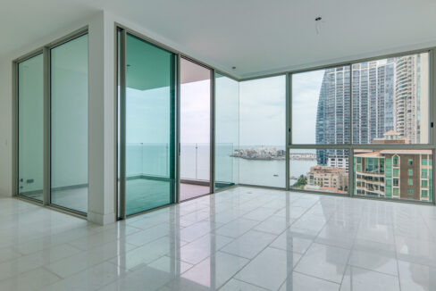 Image of the living room with ocean views in this condo for sale in Pacific Point