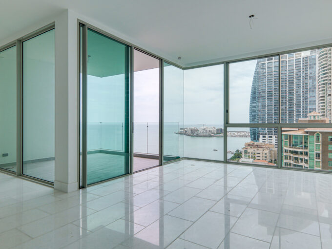 Image of the living room with ocean views in this condo for sale in Pacific Point