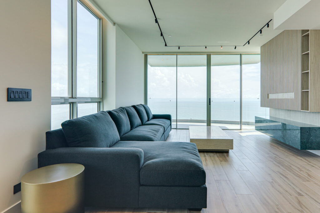Image of living area with couch and coffee table in this condo for sale in Pacific Point