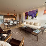 Image of living area with couch, table and dining space in this condo for sale in Celeste