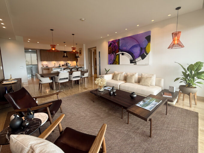 Image of living area with couch, table and dining space in this condo for sale in Celeste