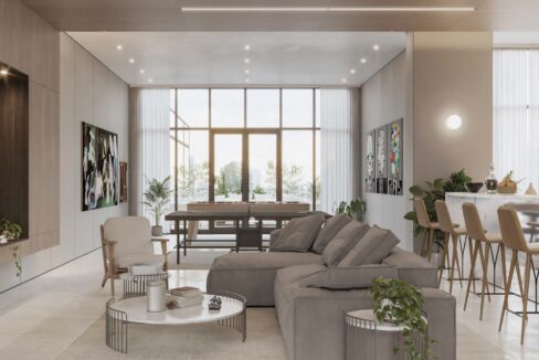 Image of living area with couch and kitchen in this Model C Condo for Sale at Aquapoint, Punta Paitilla