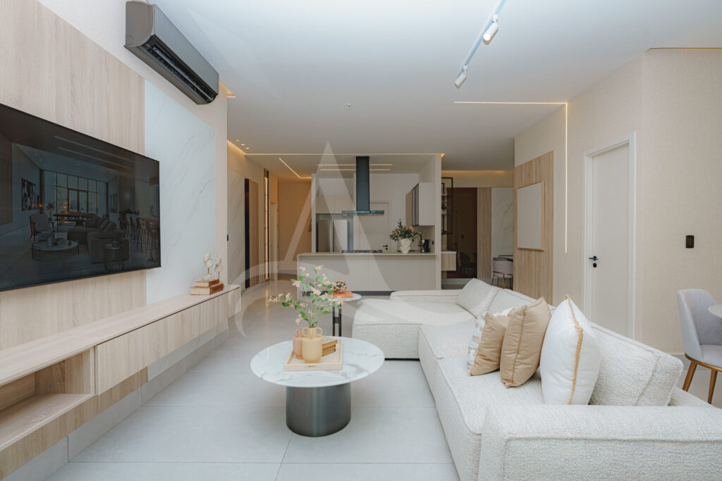 Image of living area with television, table and couch in this Model C Condo for Sale at Aquapoint, Punta Paitilla