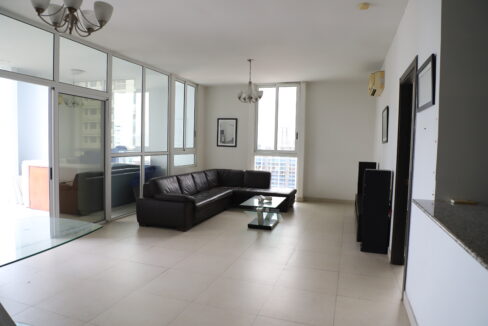 Image of living area with couch and windows in this cozy condo for sale in Quadrat