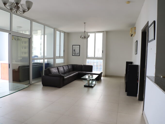 Image of living area with couch and windows in this cozy condo for sale in Quadrat