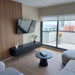 Living room with furniture in this condo for sale in Alexa