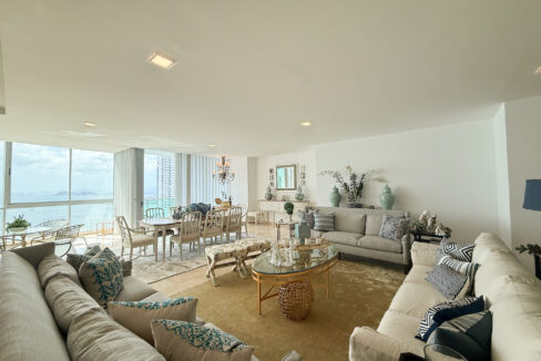 Image of living area with couches, table and chairs in this spacious condo for sale in Allure at the Park
