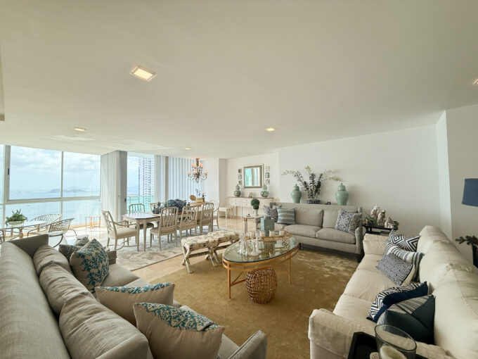 Image of living area with couches, table and chairs in this spacious condo for sale in Allure at the Park