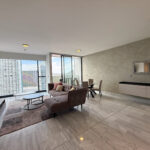 Image of living space with couch in this condo for sale in Nuovo